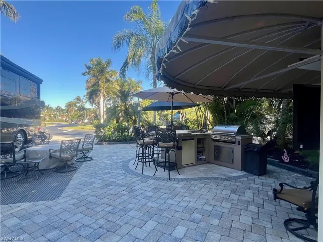 View of patio featuring area for grilling