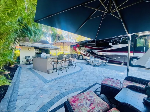 View of patio featuring exterior bar