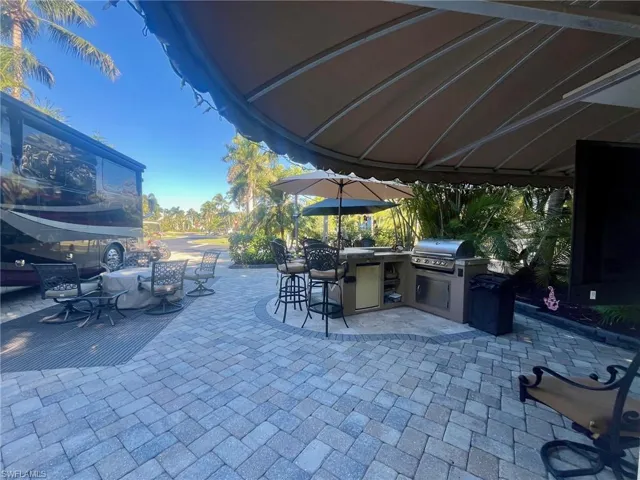 View of patio / terrace featuring an outdoor kitchen and outdoor dining area