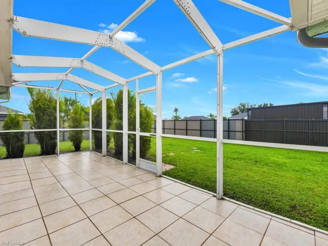 Unfurnished sunroom featuring a patio