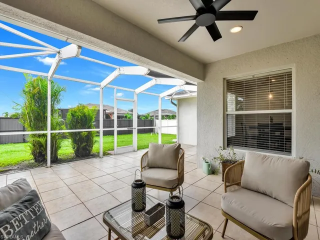 View of patio with a sunroom, a lanai, and an outdoor hangout area