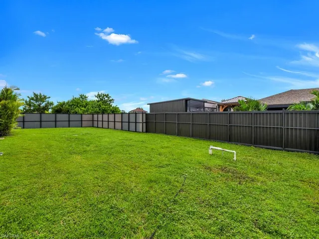 View of fenced backyard