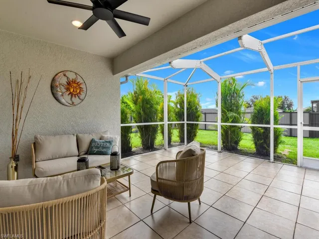 View of patio / terrace with outdoor lounge area, a sunroom, a lanai, and ceiling fan