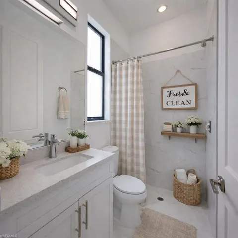 Full bath featuring vanity and a shower with curtain