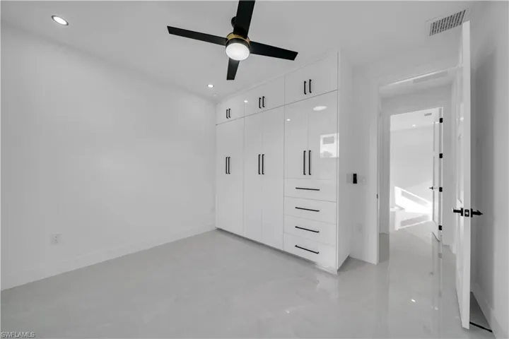 Unfurnished bedroom featuring a closet, a ceiling fan, and recessed lighting