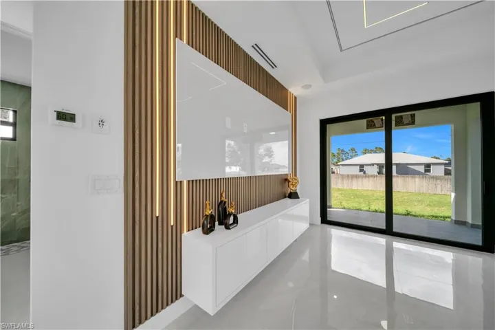 Full bath featuring plenty of natural light and a soaking tub
