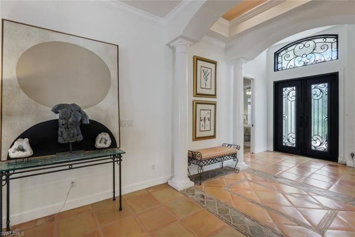 Foyer with new upscale double impact doors add to the ambiance!