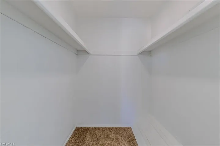 Walk-in closet off primary bedroom
