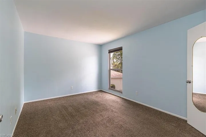 Upstairs bedroom featuring walk-in closet