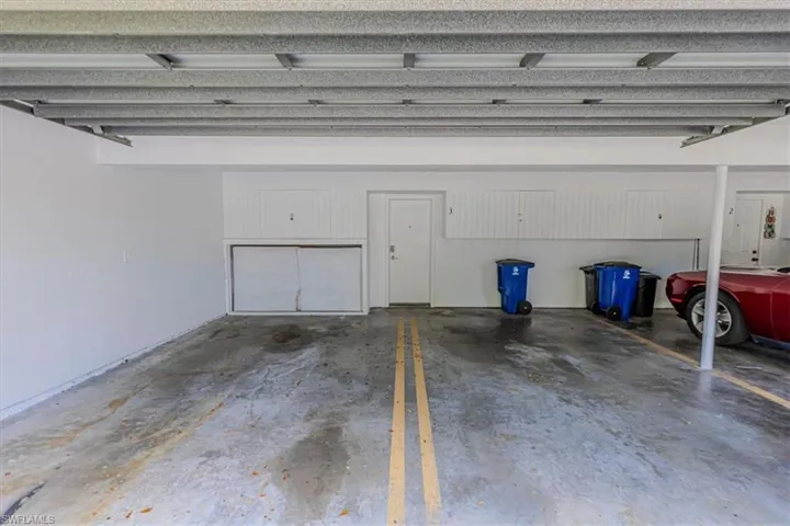 One assigned parking space (right side in photo) with door providing direct access into unit and storage space