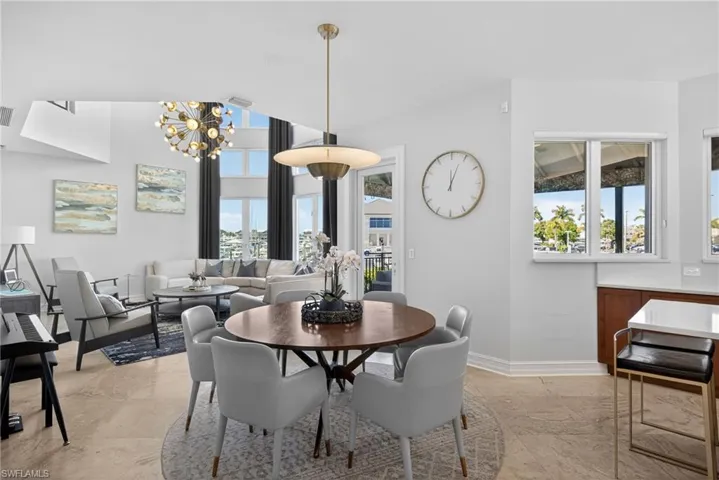 Dining space with a chandelier and baseboards