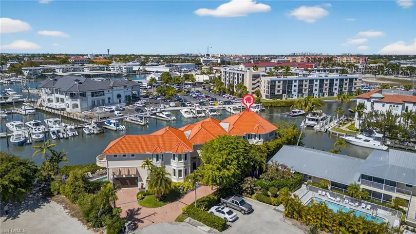 Bird's eye view of a nearby body of water and numerous boat docks