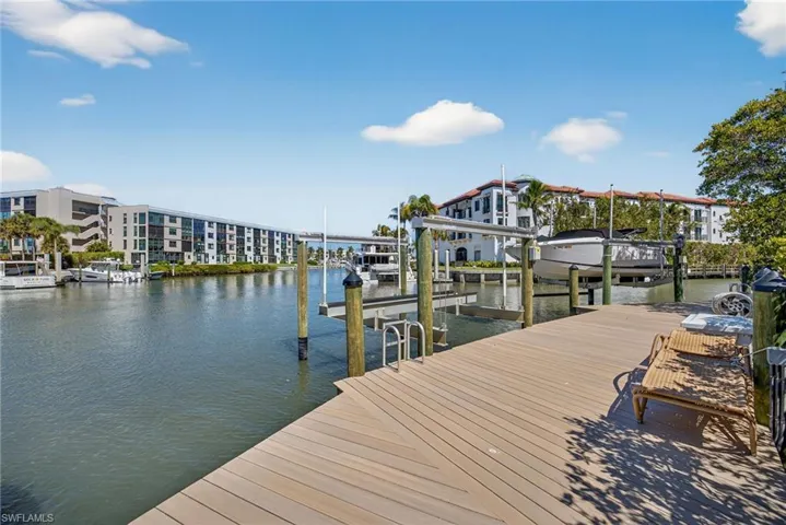 Dock with boat lift and a water view