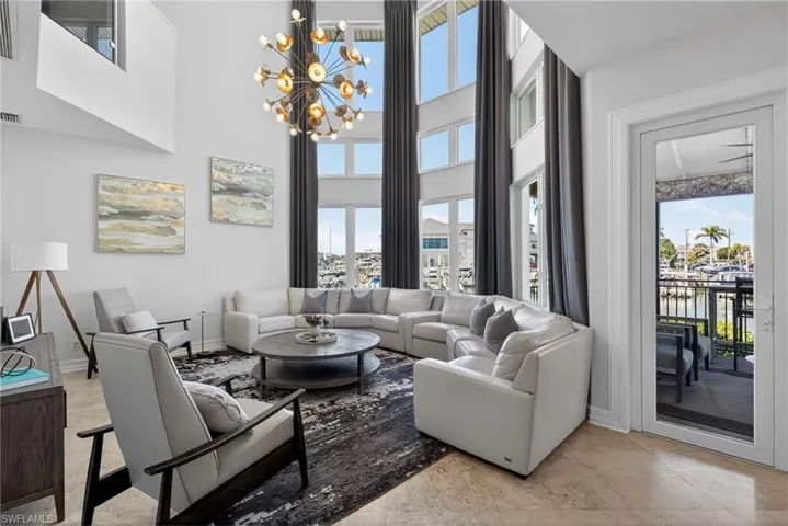 Living room with a chandelier and a high ceiling