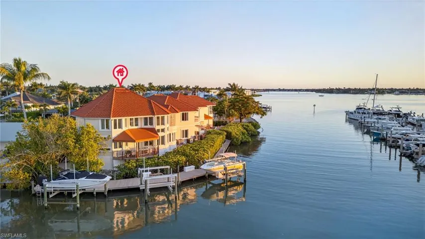 Dock featuring a water view and boat lift