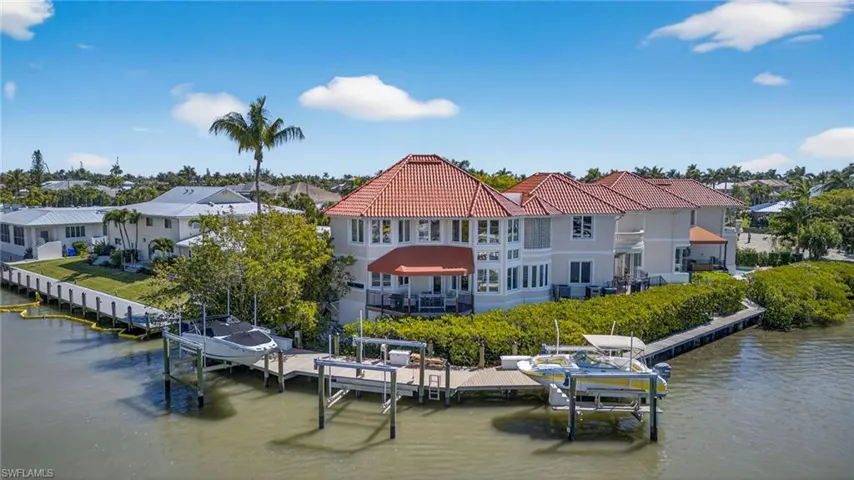 Dock with boat lift and a water view