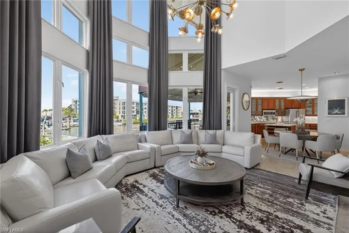 Living area with hanging lights and a high ceiling