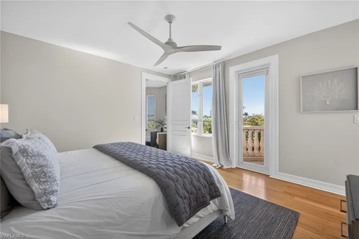 Bedroom featuring light wood-type flooring, access to outside, and ceiling fan