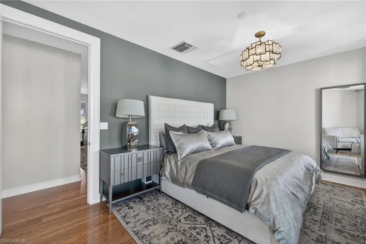 Bedroom featuring wood finished floors and baseboards