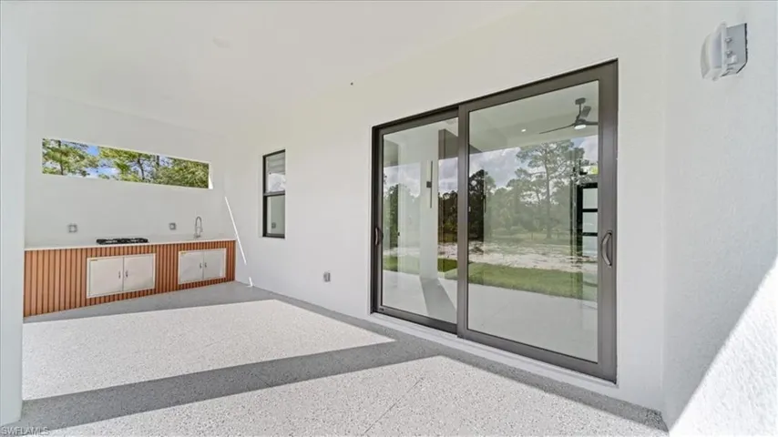 View of patio featuring an outdoor kitchen