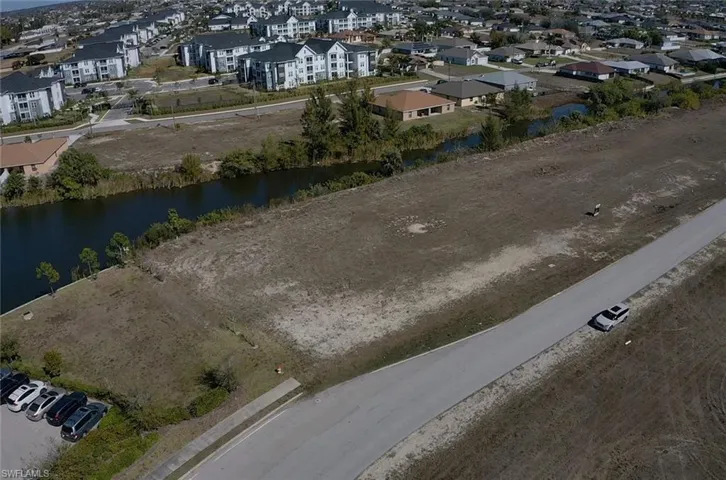 Aerial perspective of suburban area with a large body of water