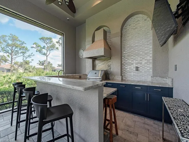 Built in outdoor kitchen with Twin Eagle Grill, sink, and refrigerator
