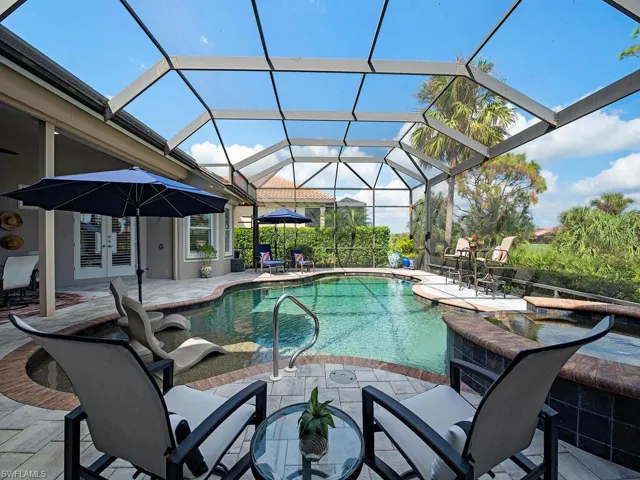 Pool with sun deck and spa