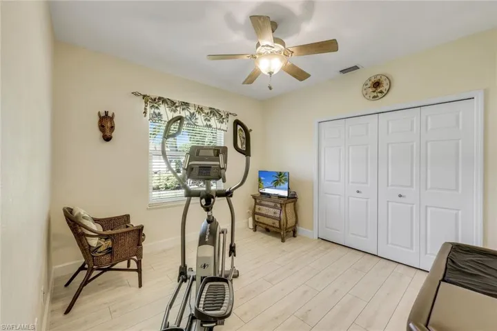 Guest bedroom two, currently serving as a fitness room.