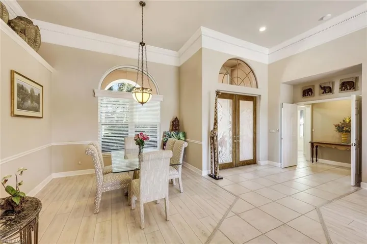 View of dining area and the grand entry door.