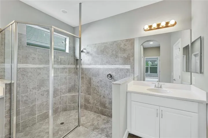 Primary Bathroom has oversize Walkin shower, dual vanities.