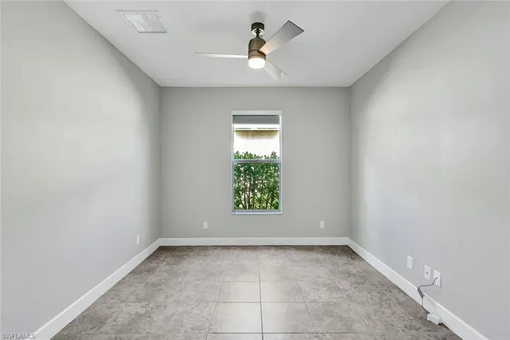 Room can be used for office, den or extra room for guests. Has pocket doors for privacy.