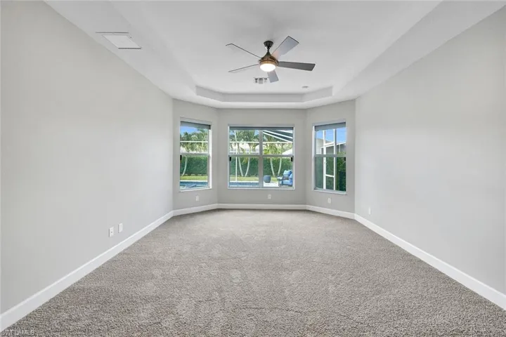 Has bay window overlooking pool area.