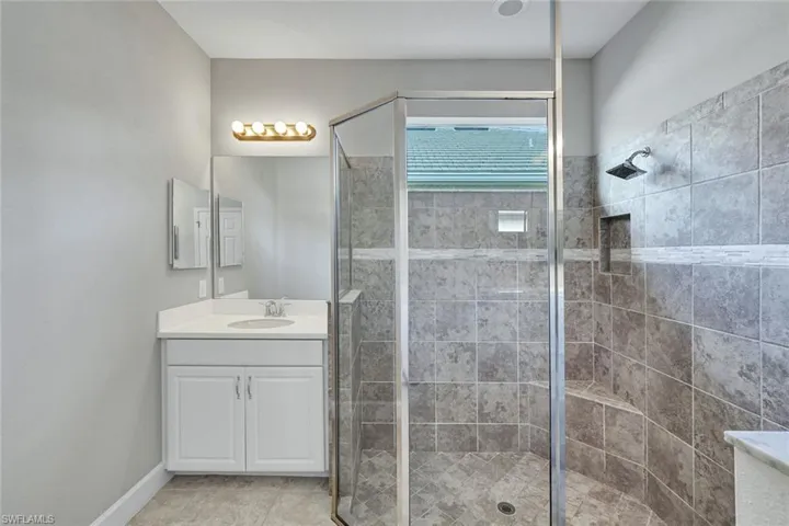 Primary Bathroom has oversize Walkin shower, dual vanities.
