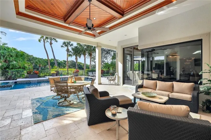 View of patio featuring an outdoor pool, a ceiling fan, outdoor dining area, outdoor lounge area, and a hot tub