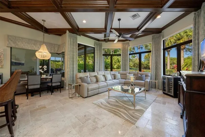 Sunroom / solarium with beamed ceiling, coffered ceiling, and wine cooler