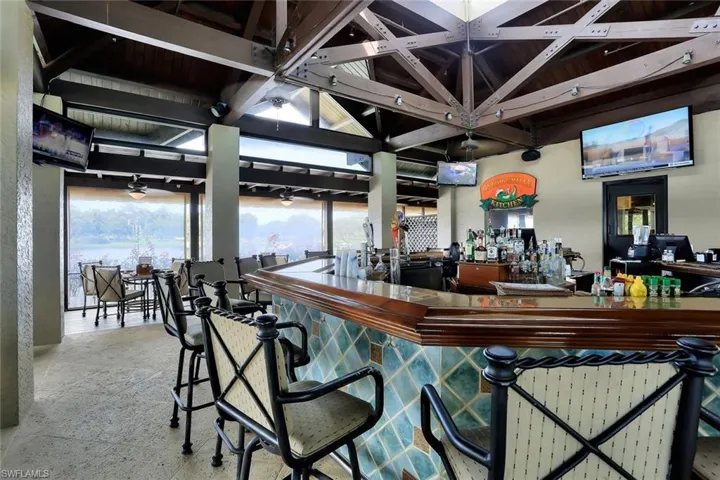 Community bar area with beamed ceiling