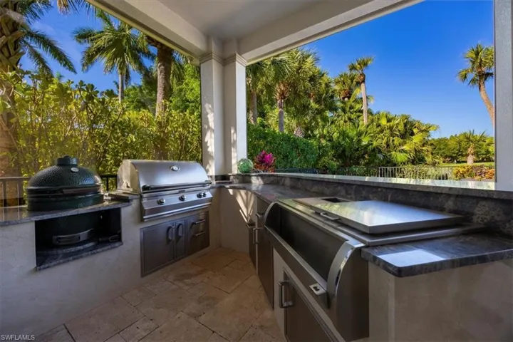 View of patio featuring area for grilling