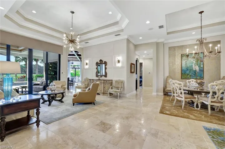 Lobby featuring ornamental molding, recessed lighting, and a towering ceiling