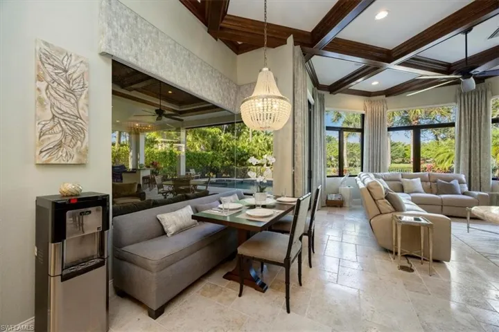 Community lobby with coffered ceiling, beam ceiling, and recessed lighting
