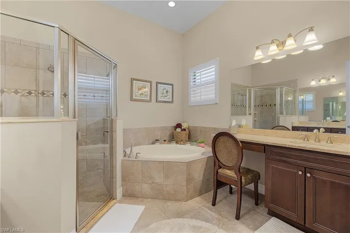 Bathroom with double vanities and soaking tub