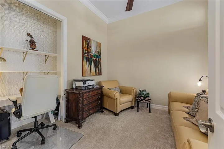 Office space featuring ornamental molding and carpet floors