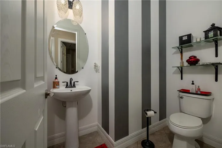 Bathroom with tile patterned floors and toilet