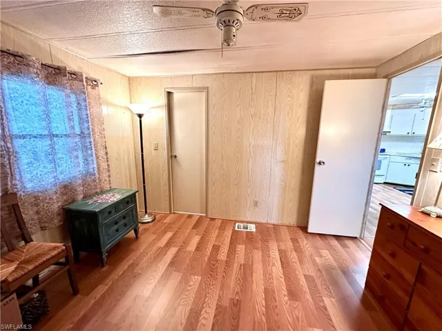 Guest Bedroom with doors to bathroom and living room.