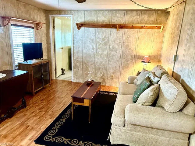 Living room located between the kitchen and bedrooms