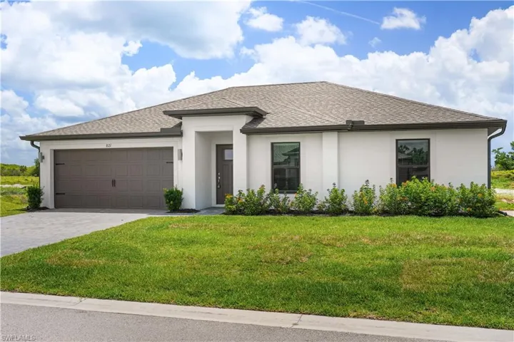 Modern single-story residence featuring a white stucco exterior, dark brown garage door with decorative hardware, and complementary dark trim