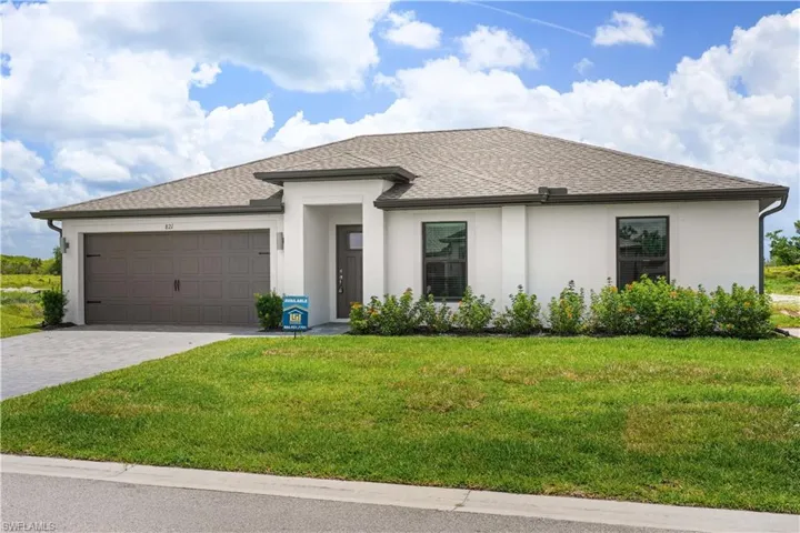 Contemporary single-story residence featuring a off-white stucco exterior with 2 car garage