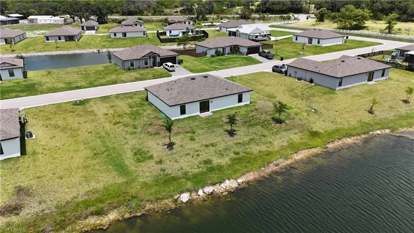 Waterfront property featuring a newly constructed residence on oversized lot