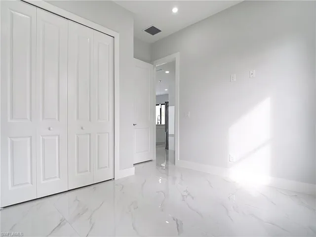 Unfurnished bedroom featuring a closet