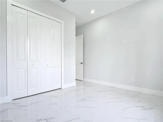 Unfurnished bedroom featuring a closet