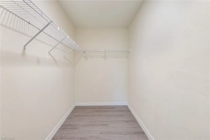 Walk in closet featuring light wood finished floors